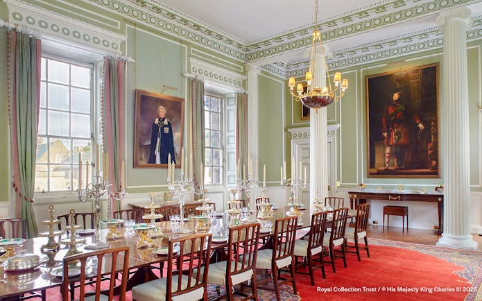 Royal Dining Room at the Palace of Holyroodhouse with ornate table settings and portraits.
