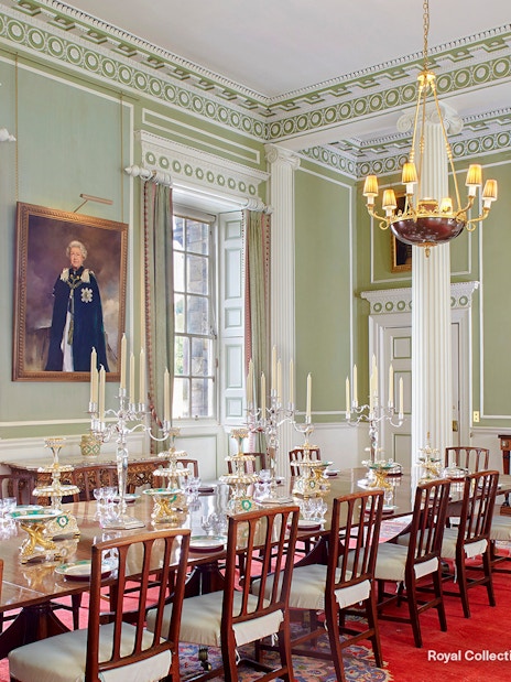 Royal Dining Room at the Palace of Holyroodhouse with ornate table settings and portraits.