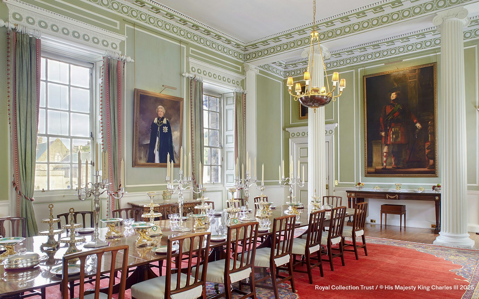 Royal Dining Room at the Palace of Holyroodhouse with ornate table settings and portraits.