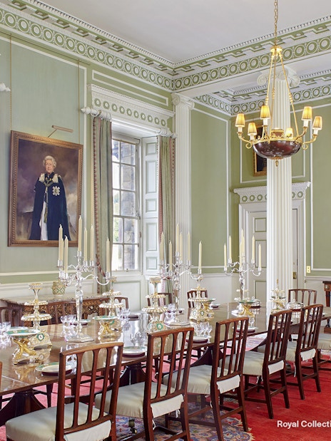 Royal Dining Room at the Palace of Holyroodhouse with ornate table settings and portraits.