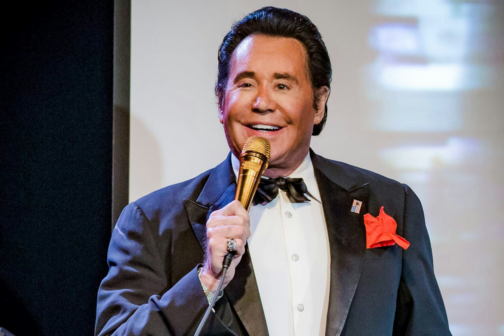 Performer on stage with a microphone during "Wayne Newton - Up Close and Personal" show.