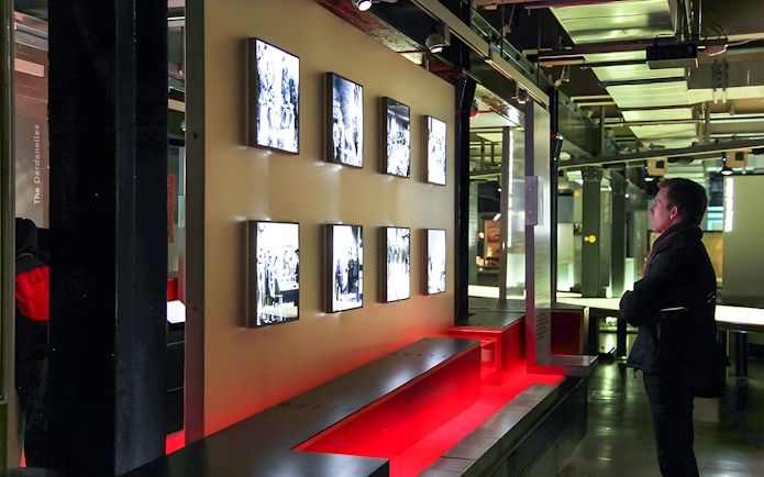 Visitor observing displays at Churchill's War Rooms in London.