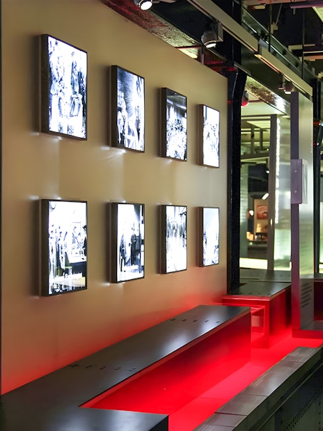 Visitor observing displays at Churchill's War Rooms in London.