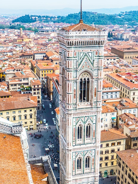 Giotto's Bell Tower in Florence, Italy, overlooking the cityscape.