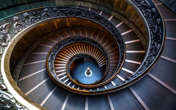 Spiral staircase in Vatican Museums, part of Rome hop-on hop-off tour.