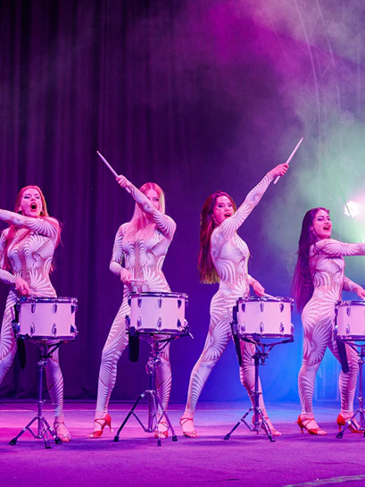 Performers drumming in synchronized routine at Phuket Circus.