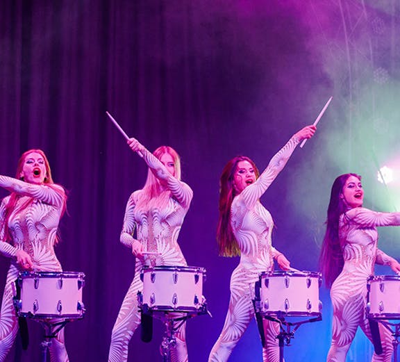 Performers drumming on stage at Aqua Circus Phuket.