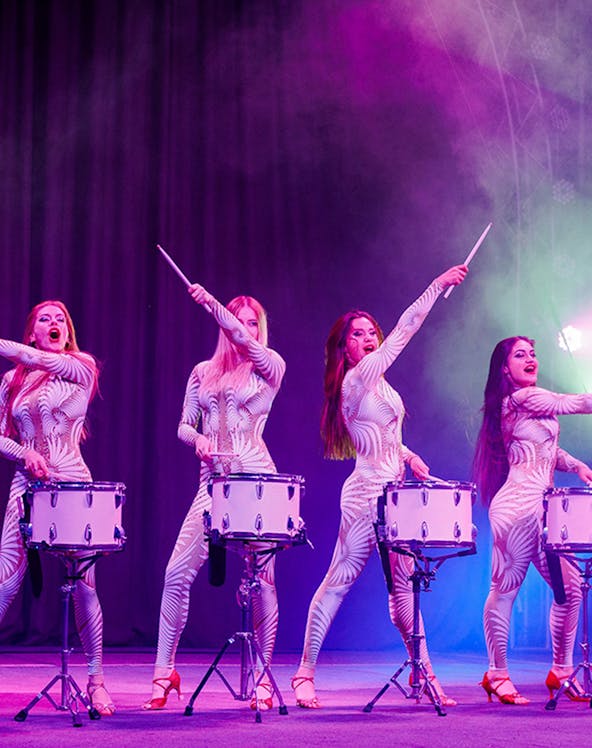 Performers drumming on stage at Aqua Circus Phuket.