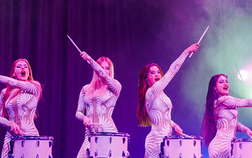 Performers drumming on stage at Aqua Circus Phuket.