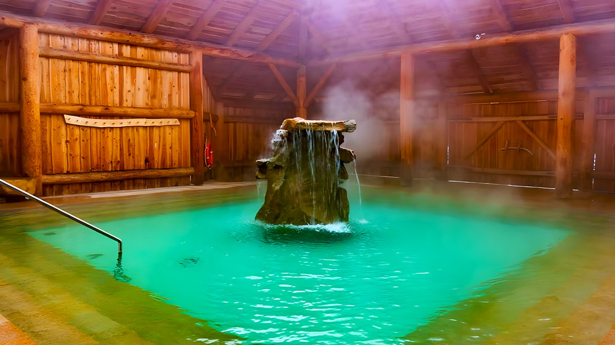Goracy Potok Thermal Bath with steaming water and wooden interior in Krakow.
