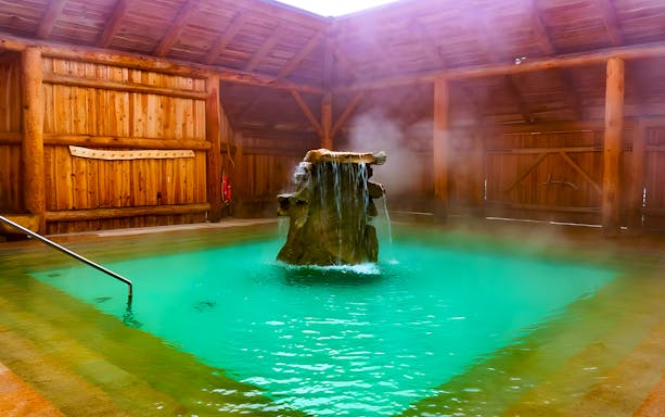 Goracy Potok Thermal Bath with steaming water and wooden interior in Krakow.