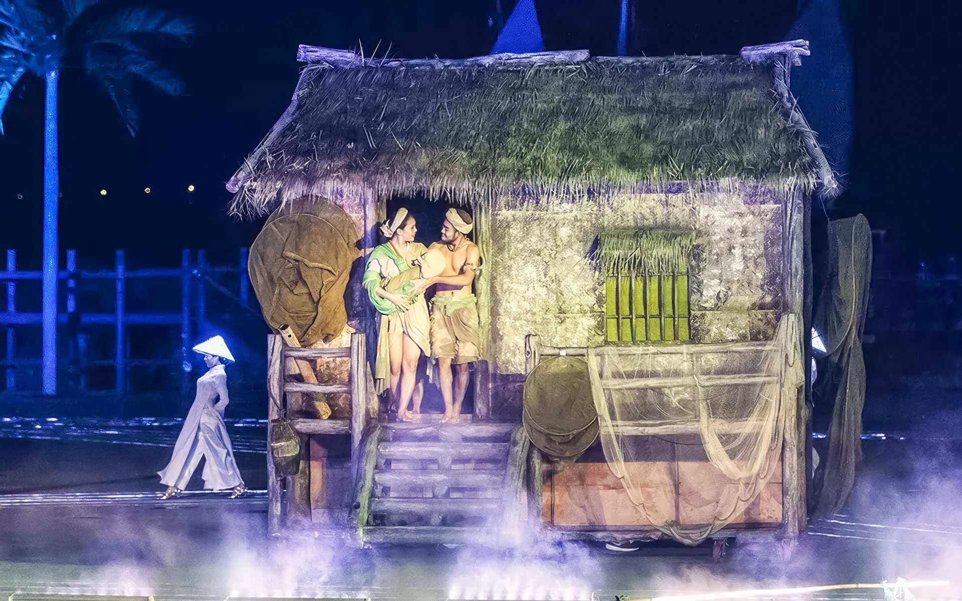 Performers in traditional attire at Hoi An Memories Show, Vietnam.