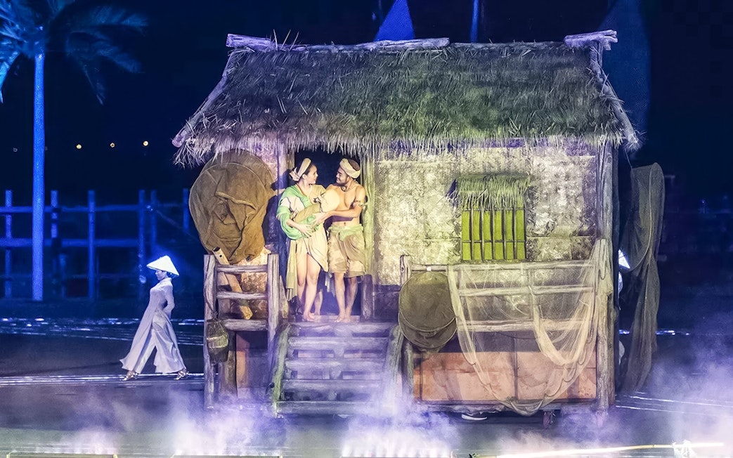 Performers in traditional attire at Hoi An Memories Show, Vietnam.