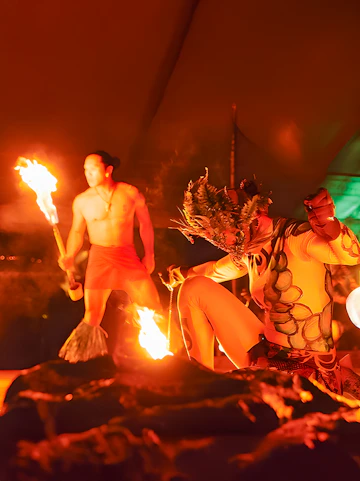 Fire dancers performing at Luau Kalamaku cultural show, Hawaii.