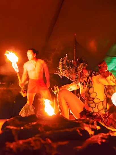 Fire dancers performing at Luau Kalamaku cultural show, Hawaii.