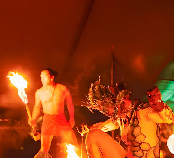 Fire dancers performing at Luau Kalamaku cultural show, Hawaii.