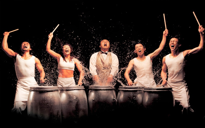 Performers drumming energetically at Jeju Nanta Musical Show.