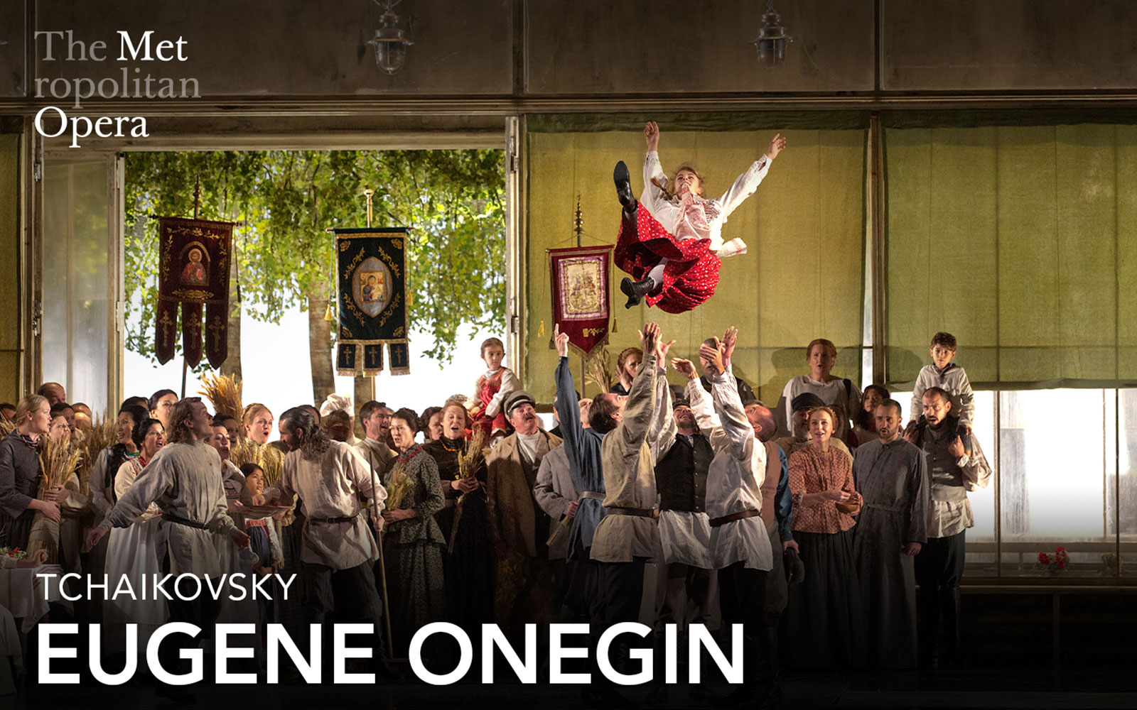 Eugene Onegin cast performing a lively scene at the Metropolitan Opera.