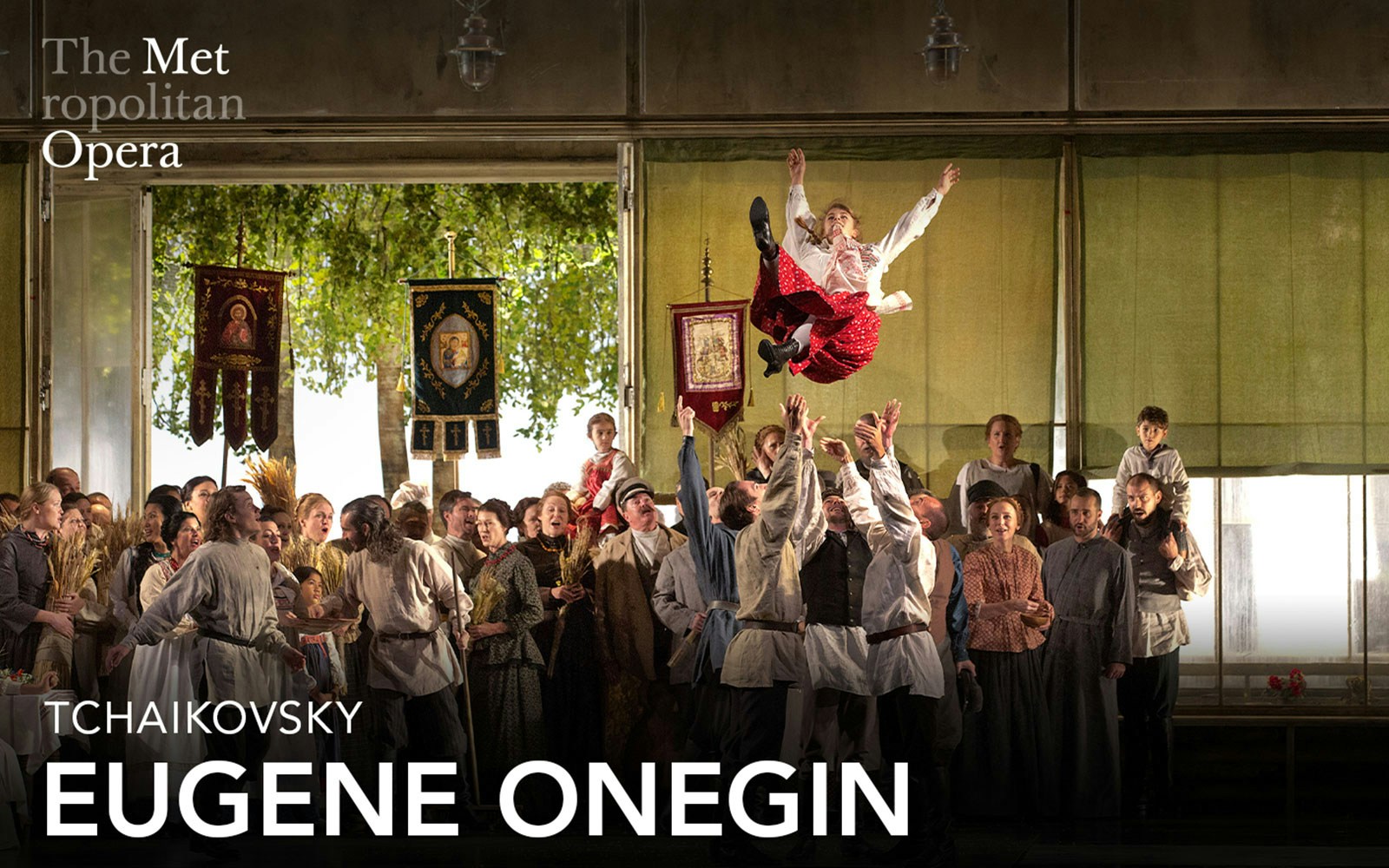 Eugene Onegin cast performing a lively scene at the Metropolitan Opera.