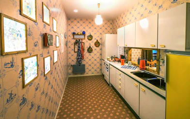 DDR Museum Berlin kitchen exhibit with vintage decor and appliances.