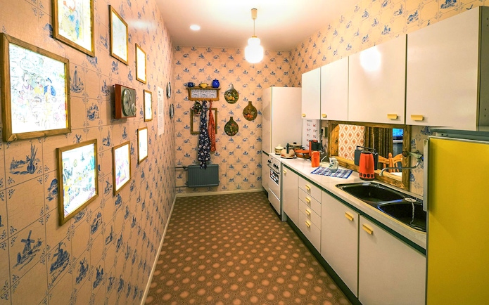 DDR Museum Berlin kitchen exhibit with vintage decor and appliances.