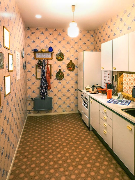 DDR Museum Berlin kitchen exhibit with vintage decor and appliances.