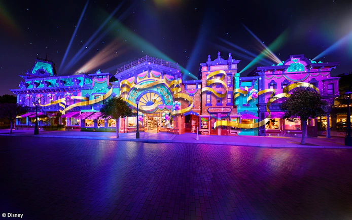 Colorful light display on Main Street for Hong Kong Disneyland's 20th anniversary celebration.