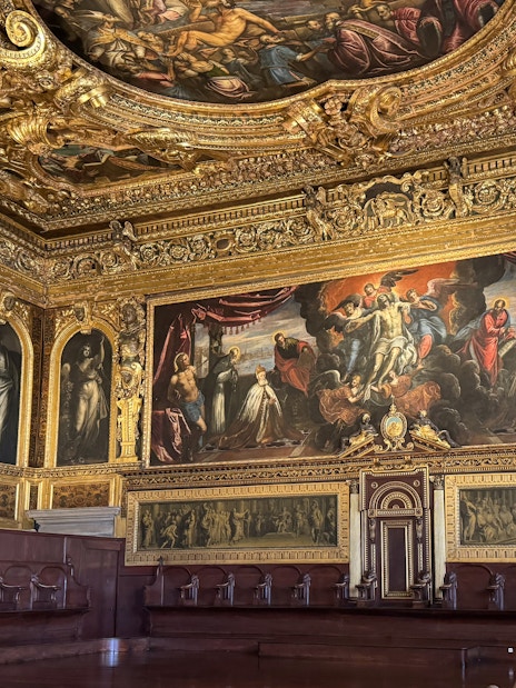 Doge's Palace interior with ornate ceiling and historic paintings, Venice.