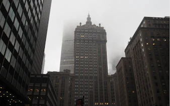 Foggy New York skyscrapers, part of the Mob Hits & Hangouts self-guided city exploration game.