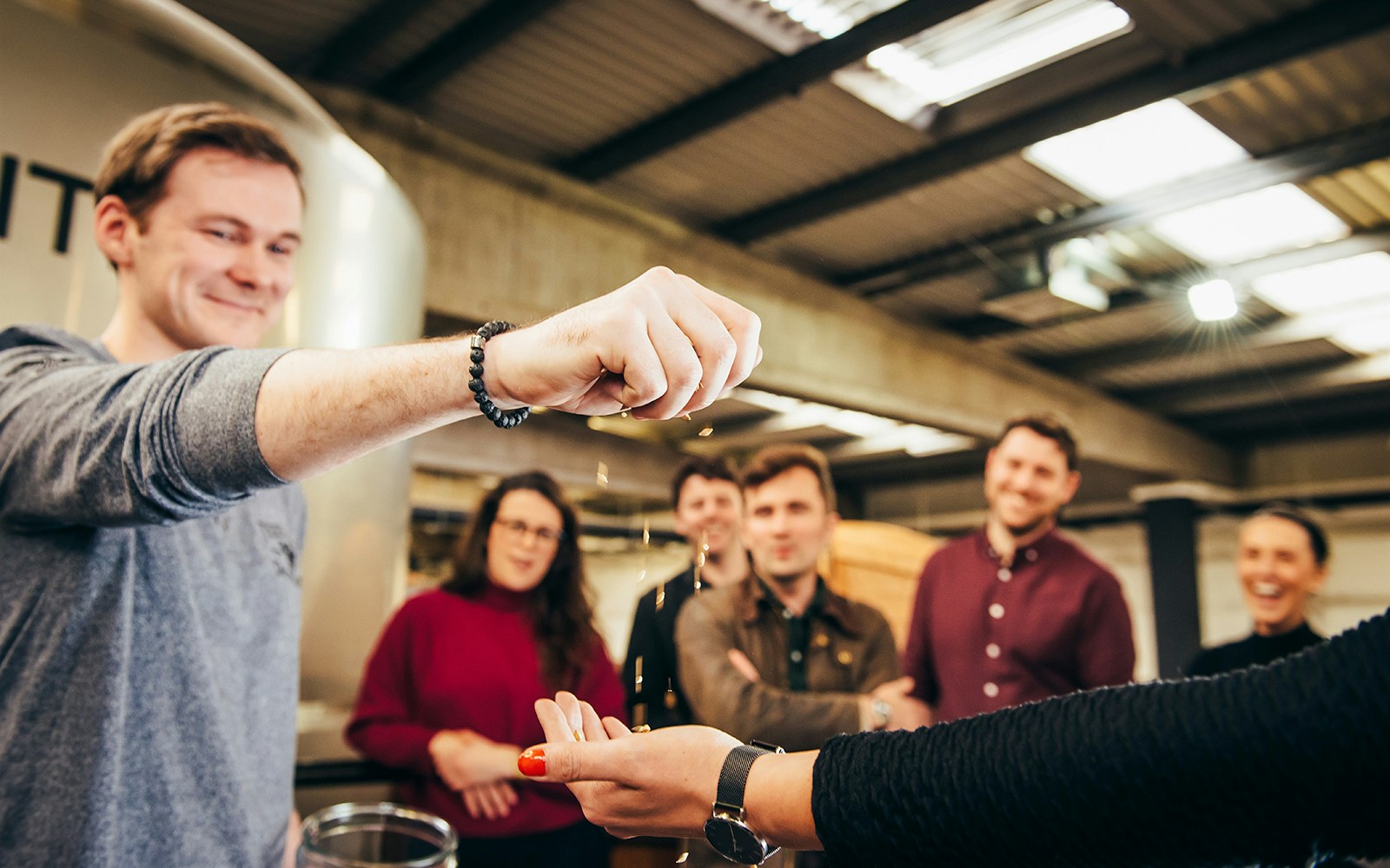 Participants enjoying a grain tasting during a guided tour of Teeling Distillery.