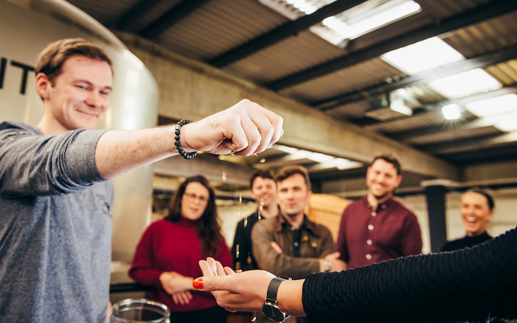 Participants enjoying a grain tasting during a guided tour of Teeling Distillery.