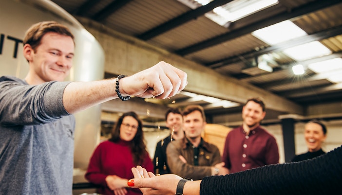 Participants enjoying a grain tasting during a guided tour of Teeling Distillery.
