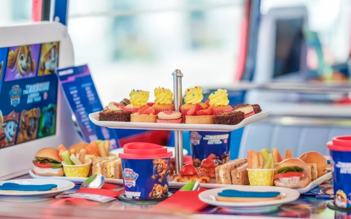 Paw Patrol themed treats on Brigit’s Afternoon Tea Bus Tour, featuring cupcakes, sandwiches, and snacks.