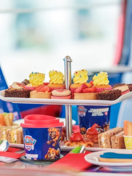 Paw Patrol themed treats on Brigit’s Afternoon Tea Bus Tour, featuring cupcakes, sandwiches, and snacks.