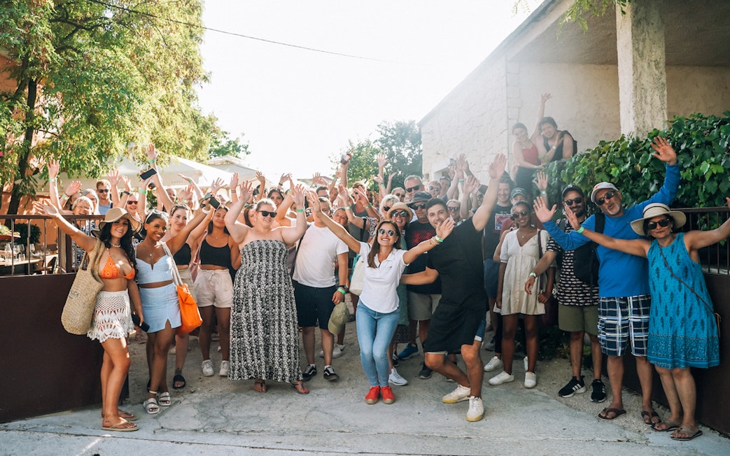 Group of tourists enjoying Krka Waterfalls tour and wine tasting near Split.