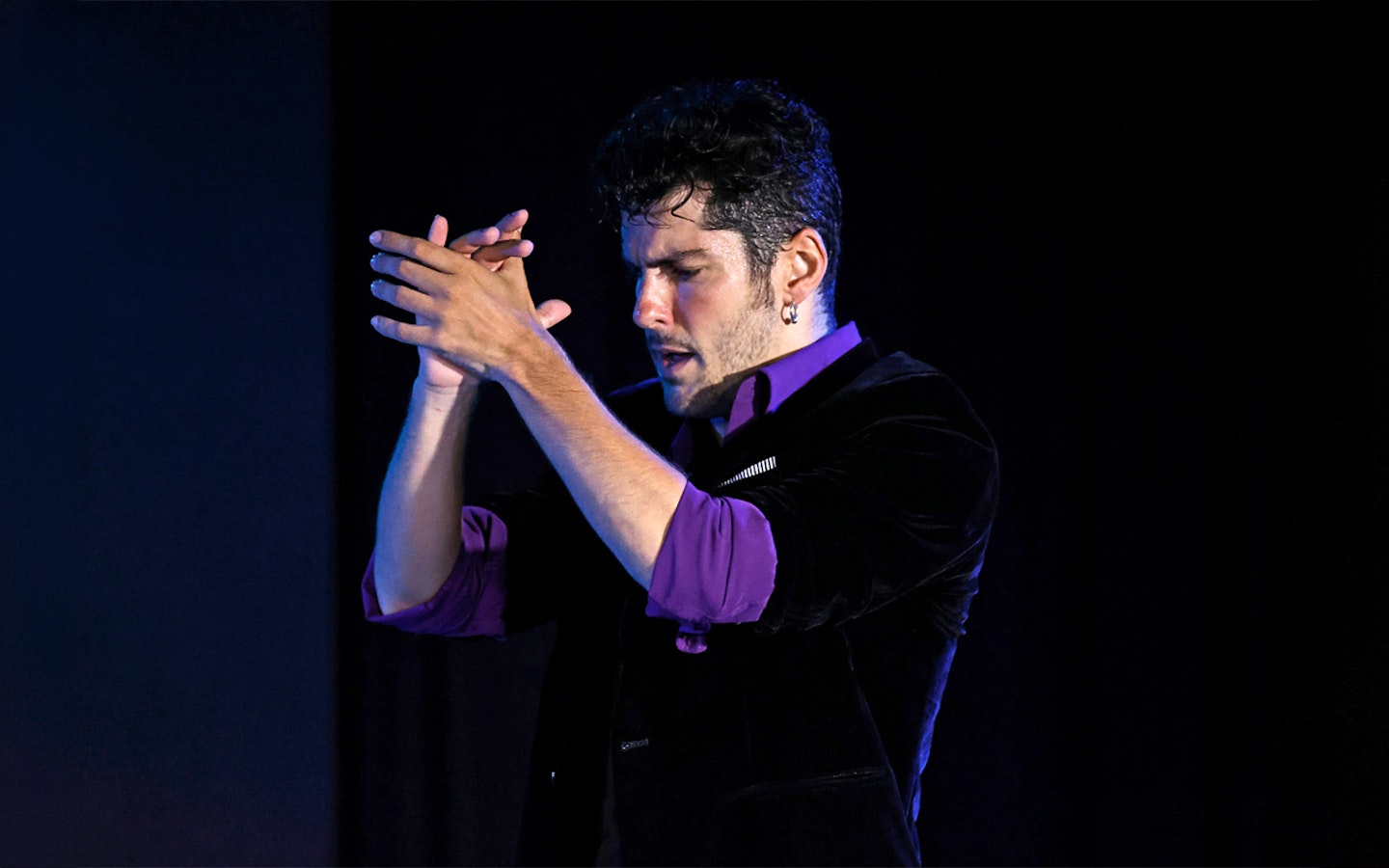 Performer clapping during Flamenco Show at Tablao Flamenco Alma.