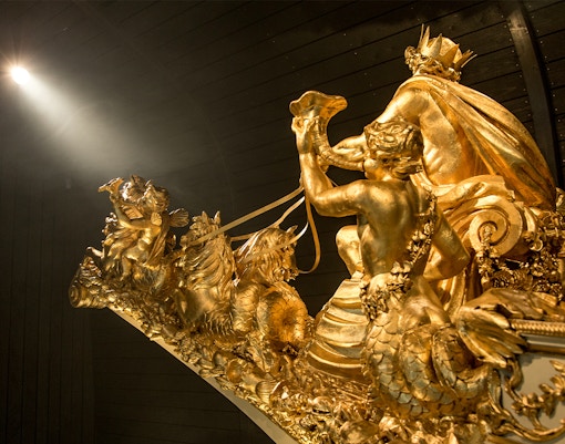 Royal Barge exhibit at The National Maritime Museum, showcasing ornate details and historical significance.