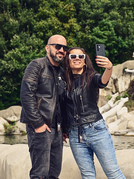 Tourists taking a selfie at the Royal Palace of Caserta fountains, Italy.
