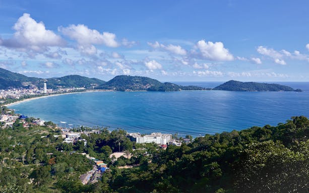Phuket's Patong Bay view from Erawan Patong Seaview Zipline, lush hills and coastline.
