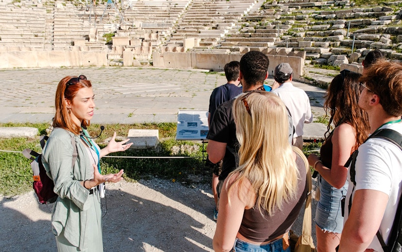 Guide leading a tour at Odeon of Herodes Atticus amphitheater, Athens.