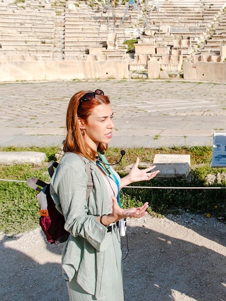 Guide leading a tour at Odeon of Herodes Atticus amphitheater, Athens.