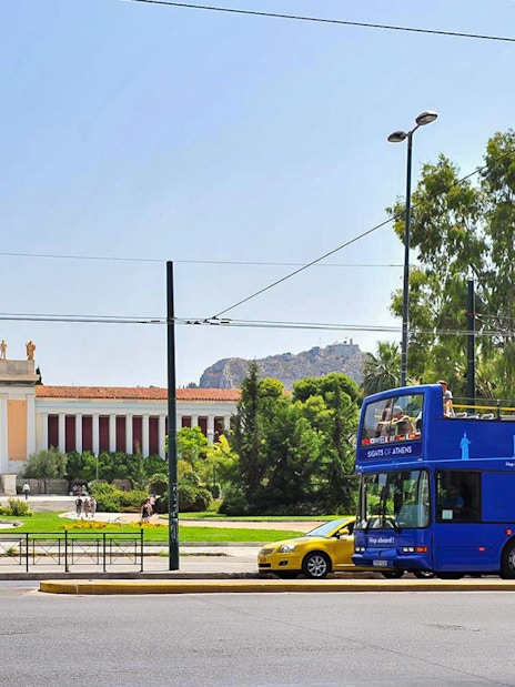 Blue tour bus in front of the National Archaeological Museum, Athens, on Hop on Hop off Classic Tour.