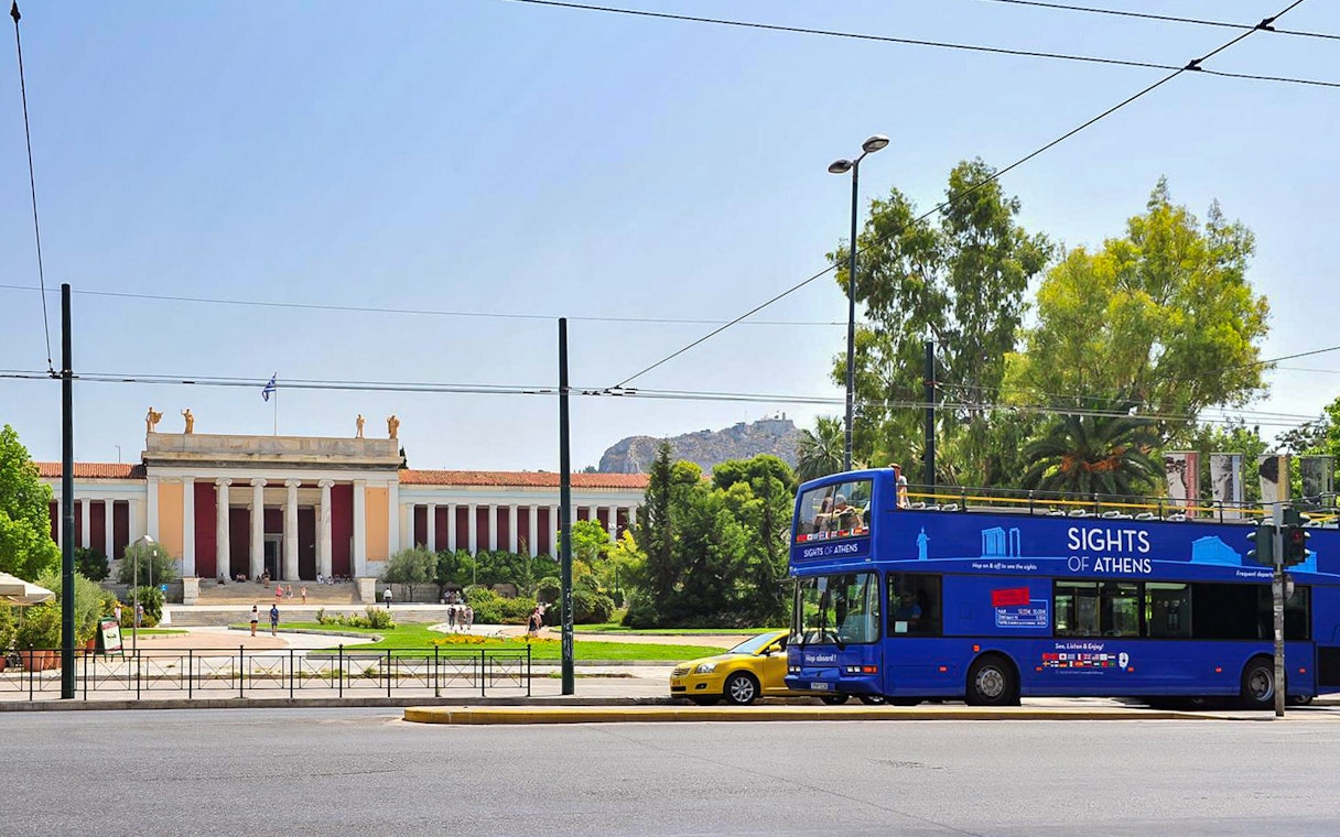 Blue tour bus in front of the National Archaeological Museum, Athens, on Hop on Hop off Classic Tour.