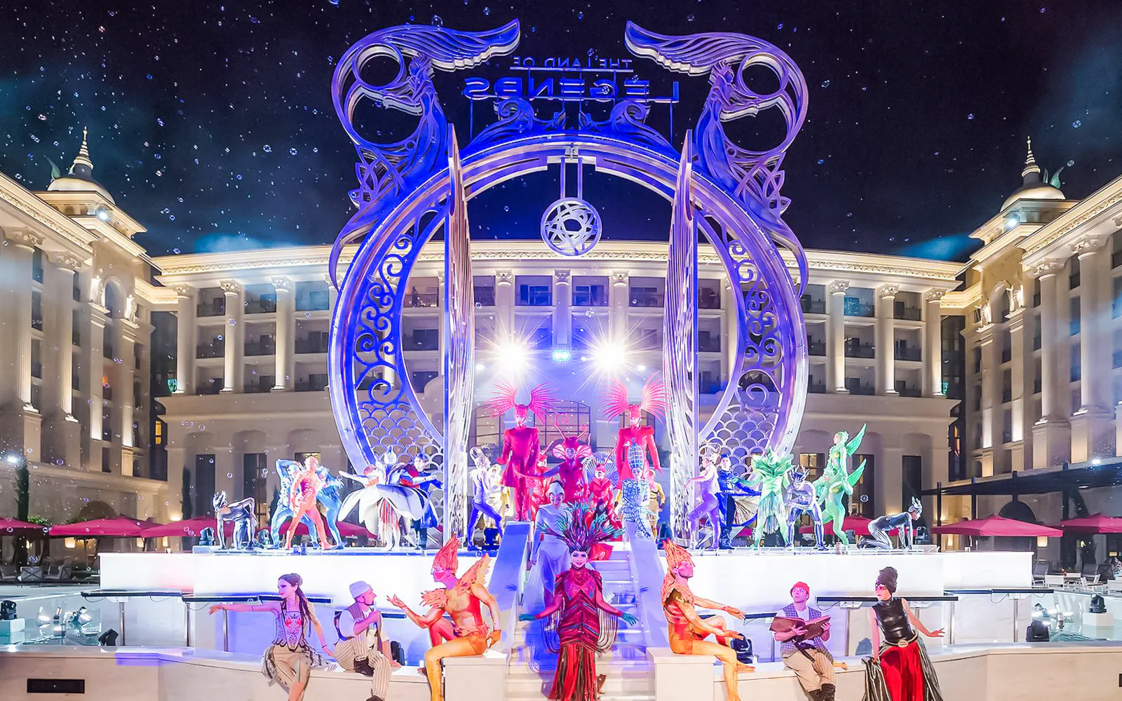 Performers in vibrant costumes at Land of Legend Night Show, Antalya.