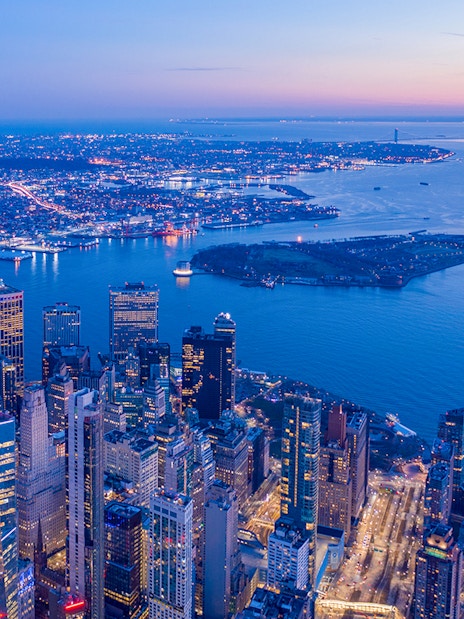Aerial view of New York City skyline from One World Observatory at dusk.