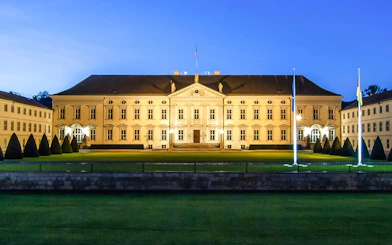 Schloss Bellevue illuminated at night in Berlin, Germany.