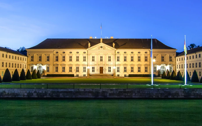 Schloss Bellevue illuminated at night in Berlin, Germany.