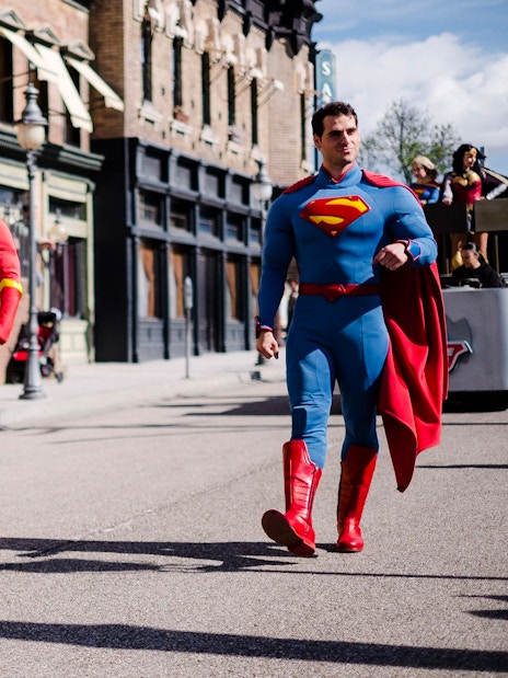 Batman, The Flash, and Superman walking in DC Super Heroes World at Parque Warner Madrid.