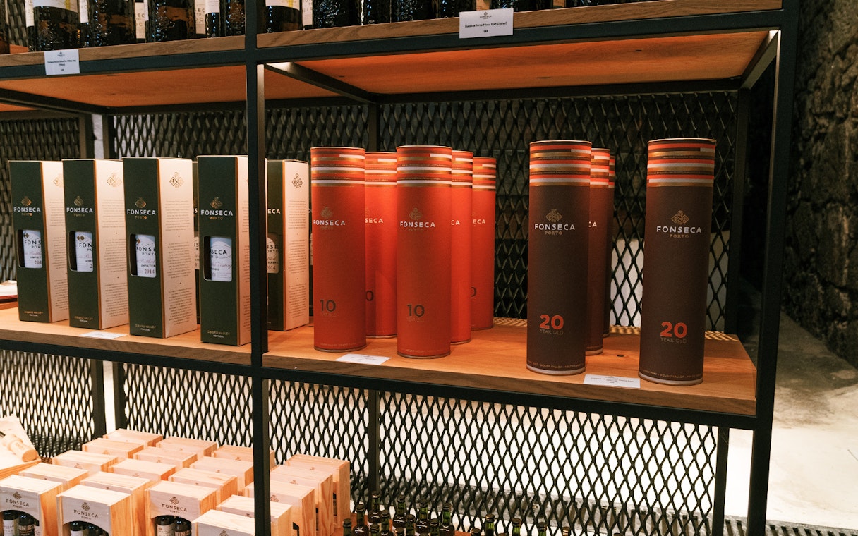 Fonseca port wine bottles and packaging on display at a cellar in Portugal.