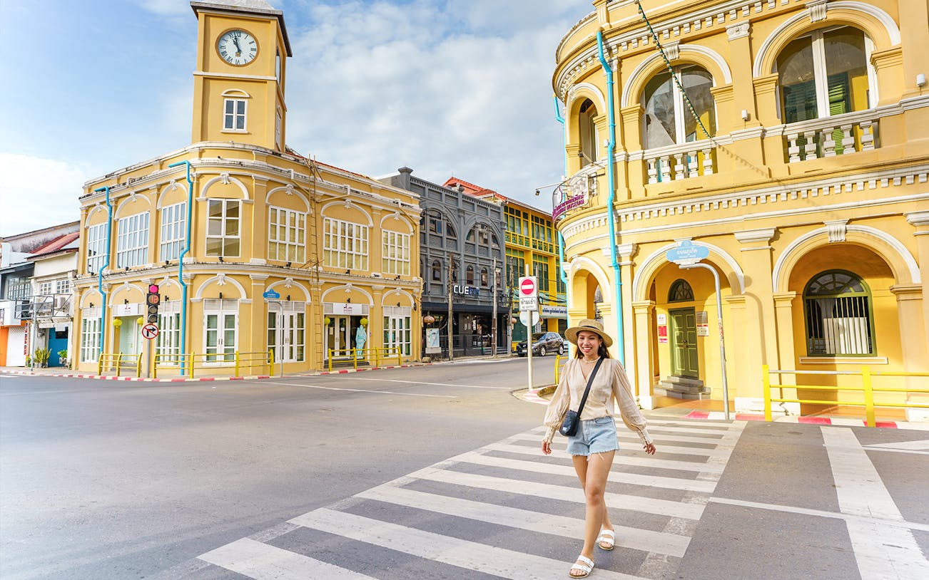 Traveler walking in Phuket Old Town with Sino-Portuguese architecture buildings, Phuket, Thailand.